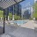 Large sparkling blue pool with a large pool deck and lounge chairs